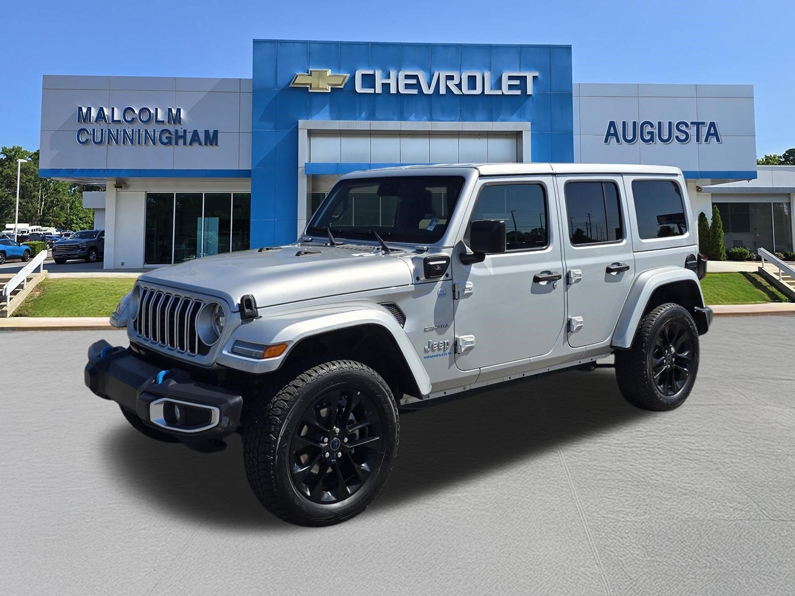 2024 Jeep Wrangler 4xe Sahara in Silver — front three-quarter view