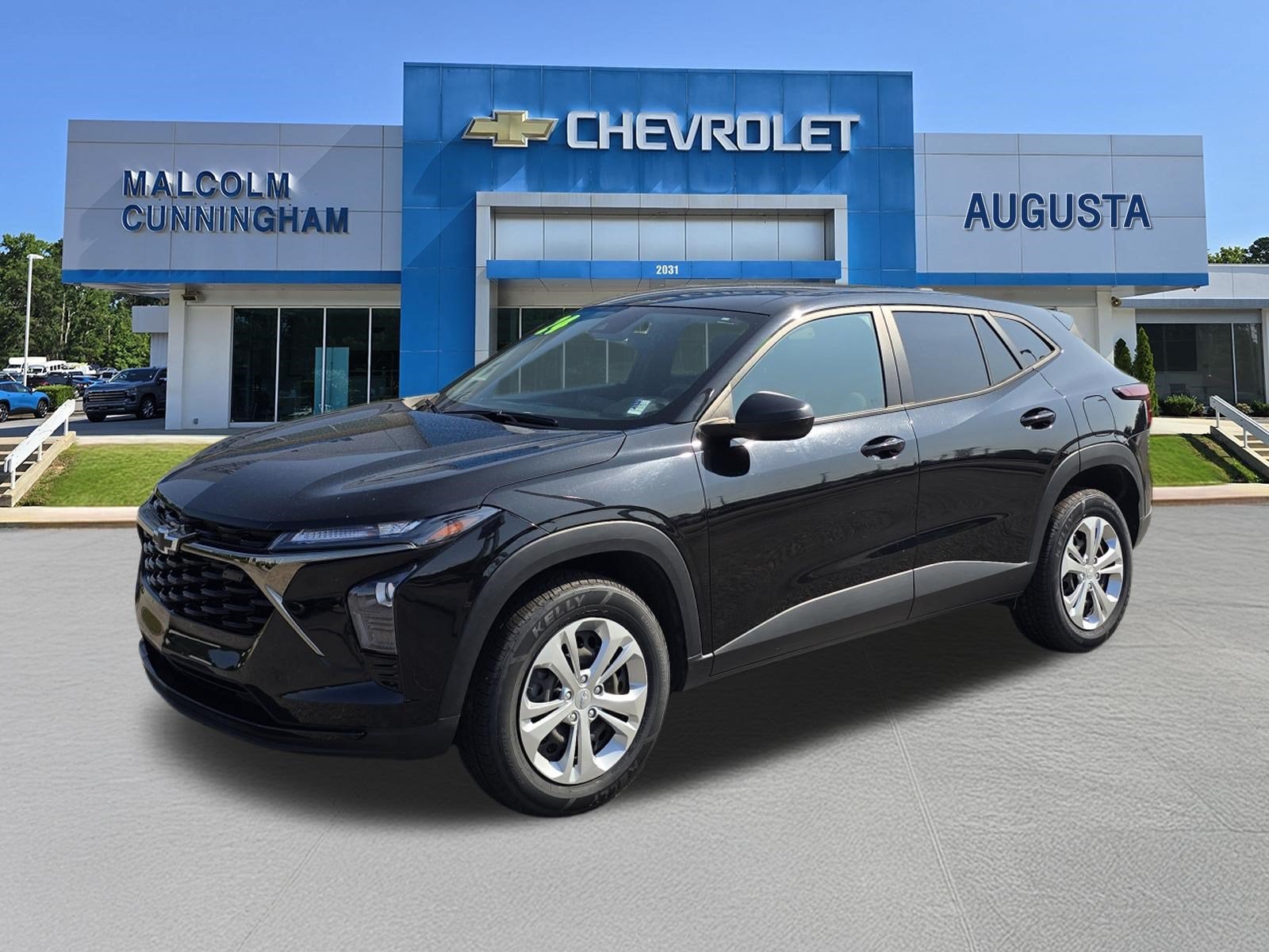 2024 Chevrolet Trax LS in Mosaic Black Metallic — front three-quarter view
