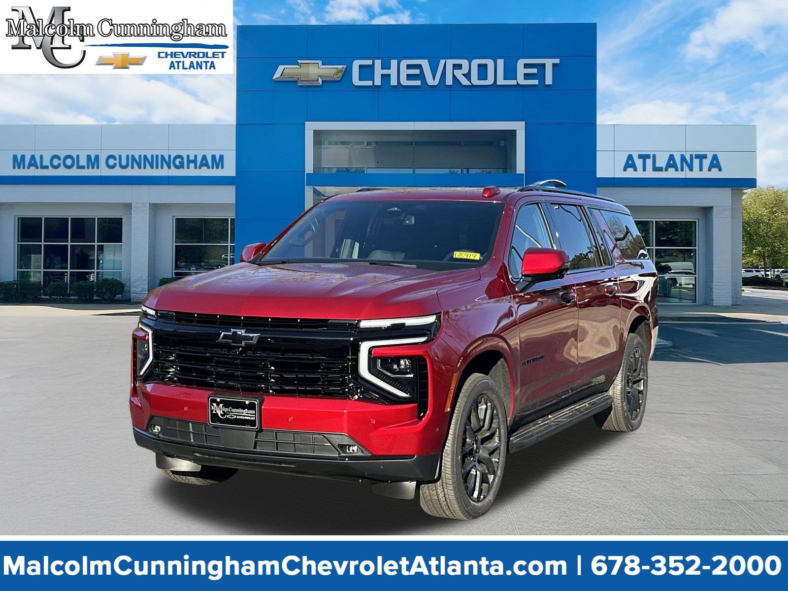 2026 Chevrolet Suburban RST in Radiant Red Tintcoat — front three-quarter view