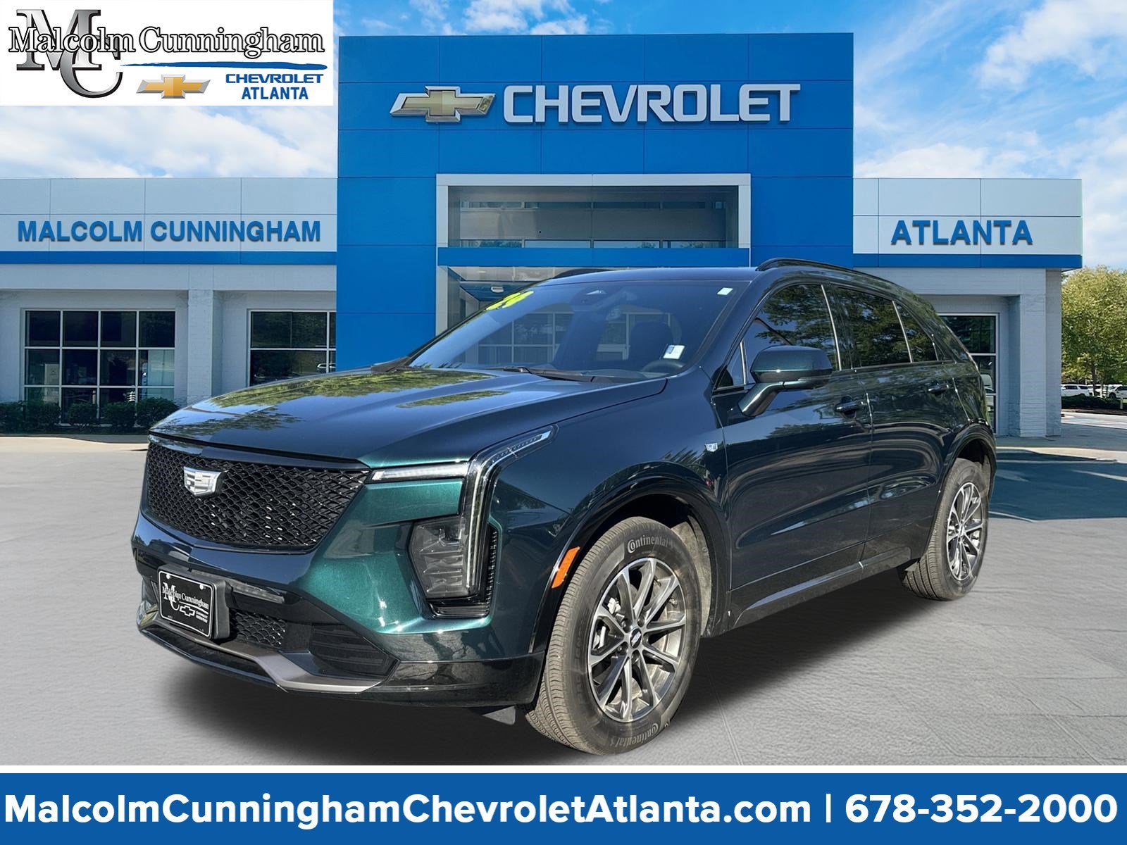 2024 Cadillac XT4 Sport in Emerald Lake Metallic — front three-quarter view